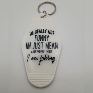 Handmade White Motel Keychain With Humorous Text